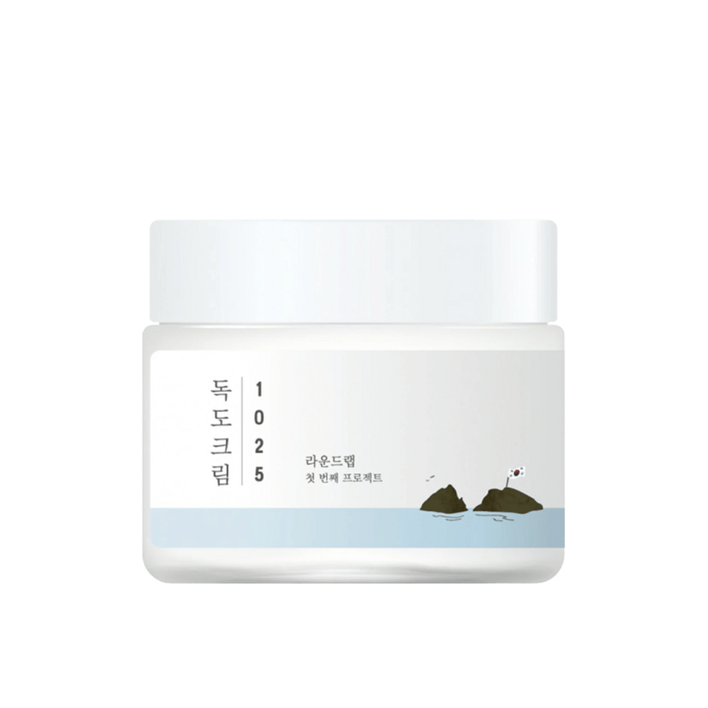 En burk med Round Lab 1025 Dokdo Cream 80ml för återfuktning på vit bakgrund.