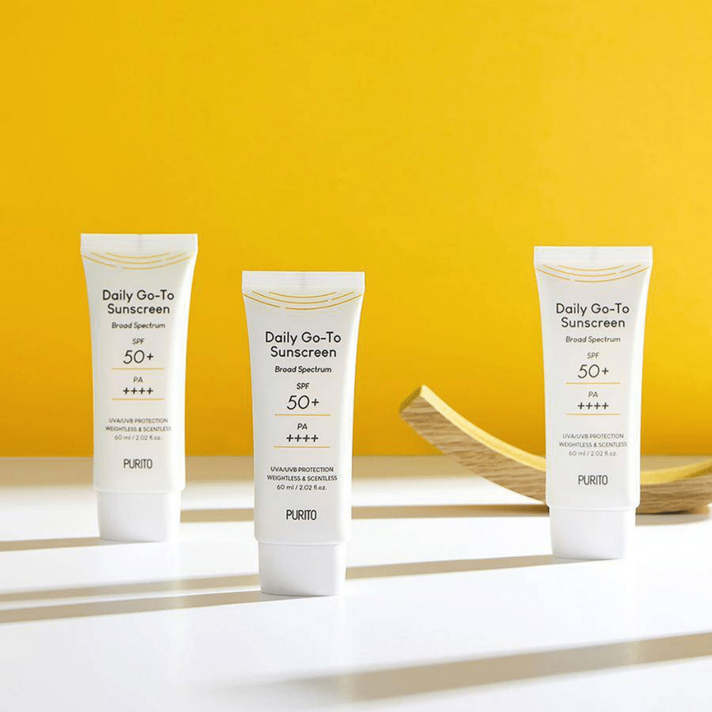 Tre tuber PURITO Daily Go-To Sunscreen SPF 50+ PA++++ 60ml sittande på ett bord.